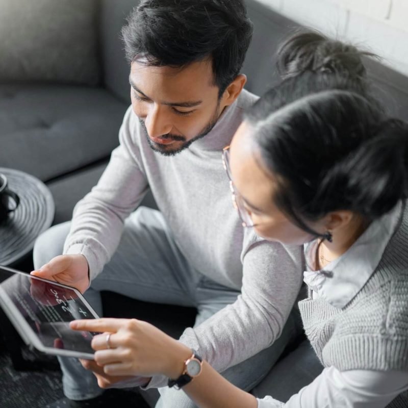 tablet-sofa-and-couple-with-smart-home-technology-for-thermostat-heating-apartment-security-netwo.jpg